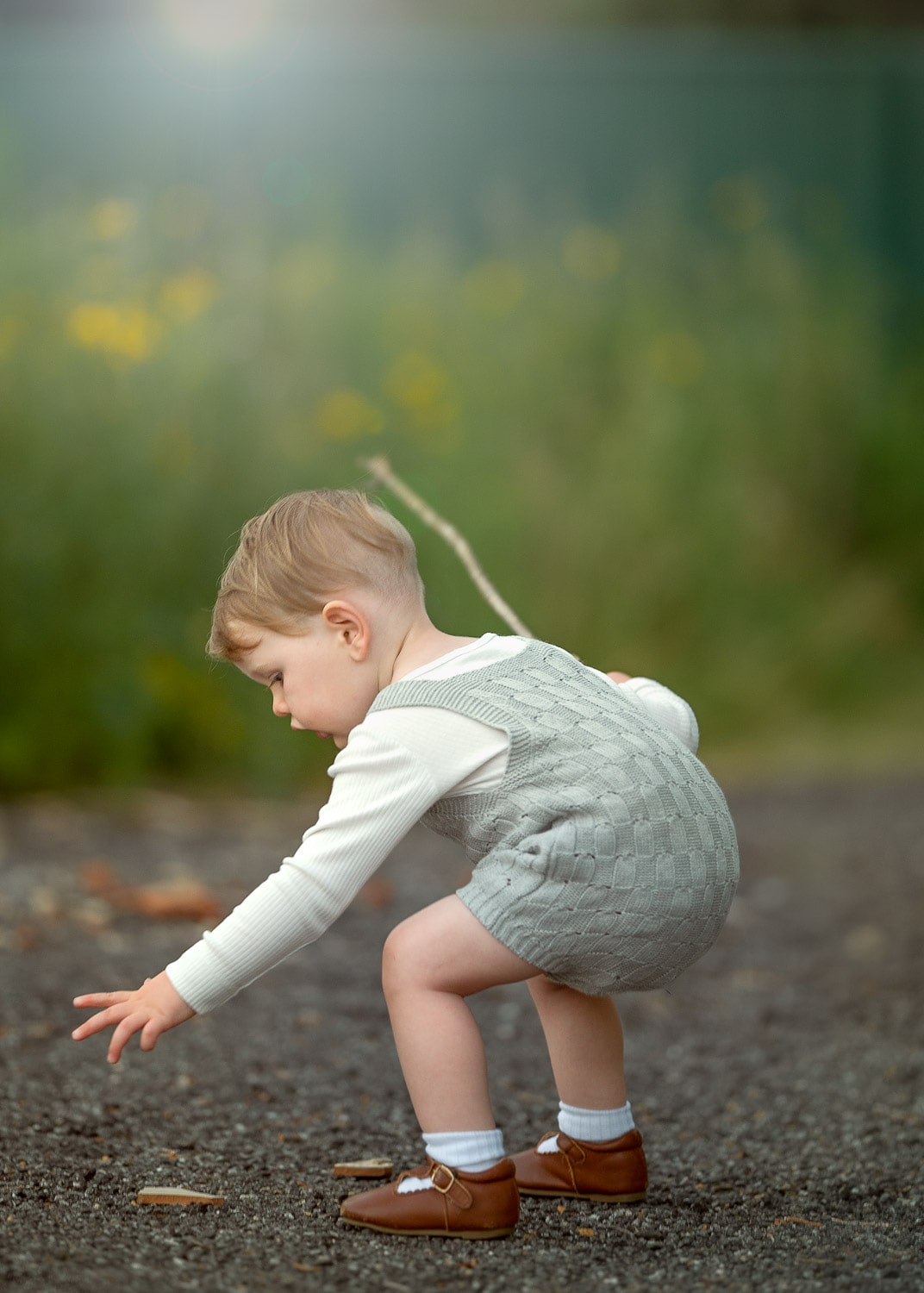 Perth Children Photographer - A toddler engaging with surroundings during outdoor photo shoot