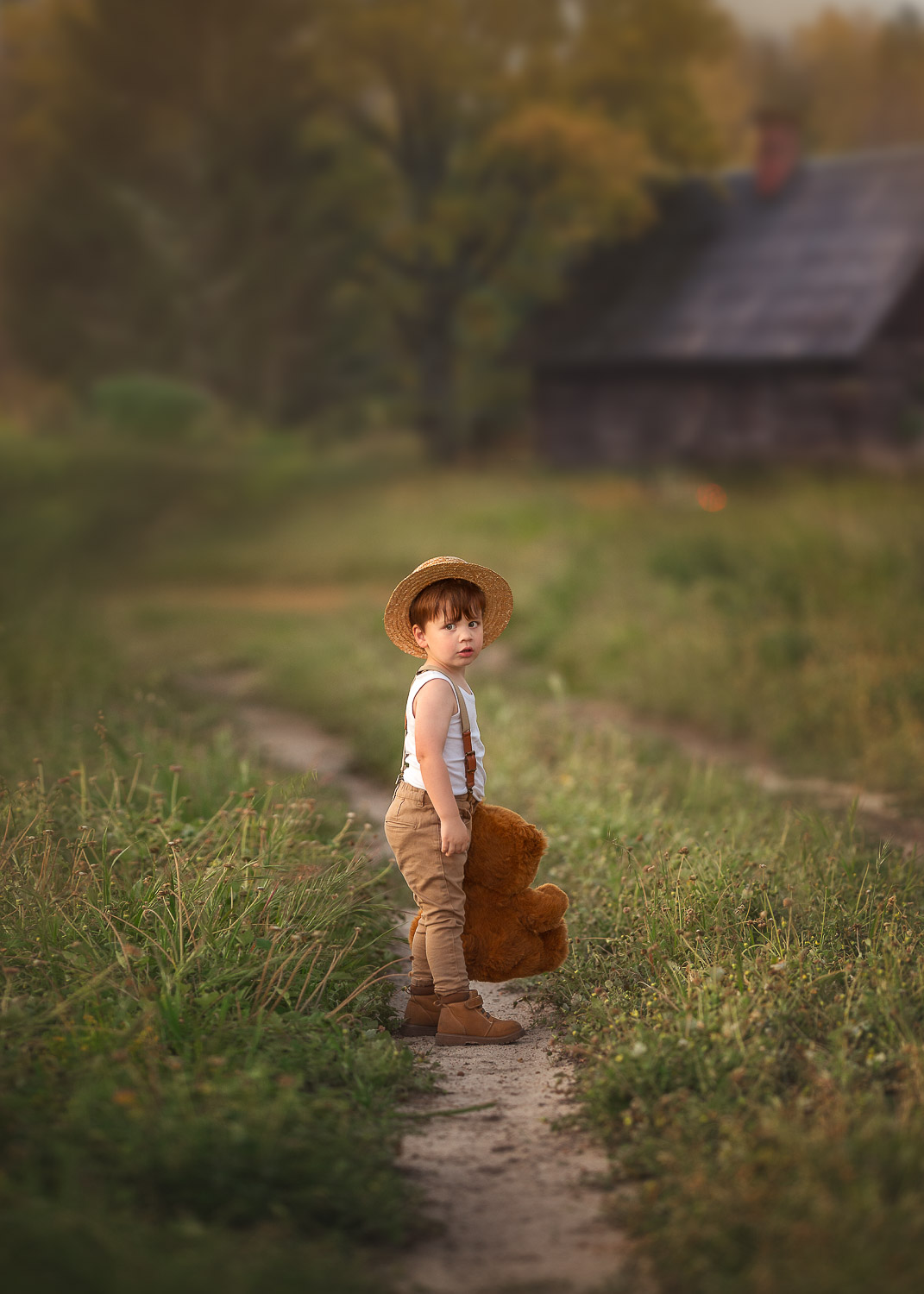 Perth boy holding teddy bear during outdoor photo shoot