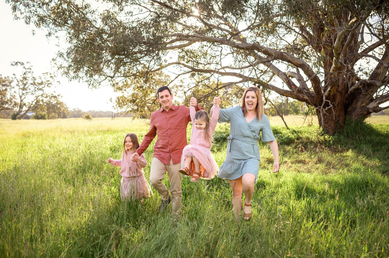 Perth family playing together during outdoor family portrait sessions at Lilac Hill Guildford