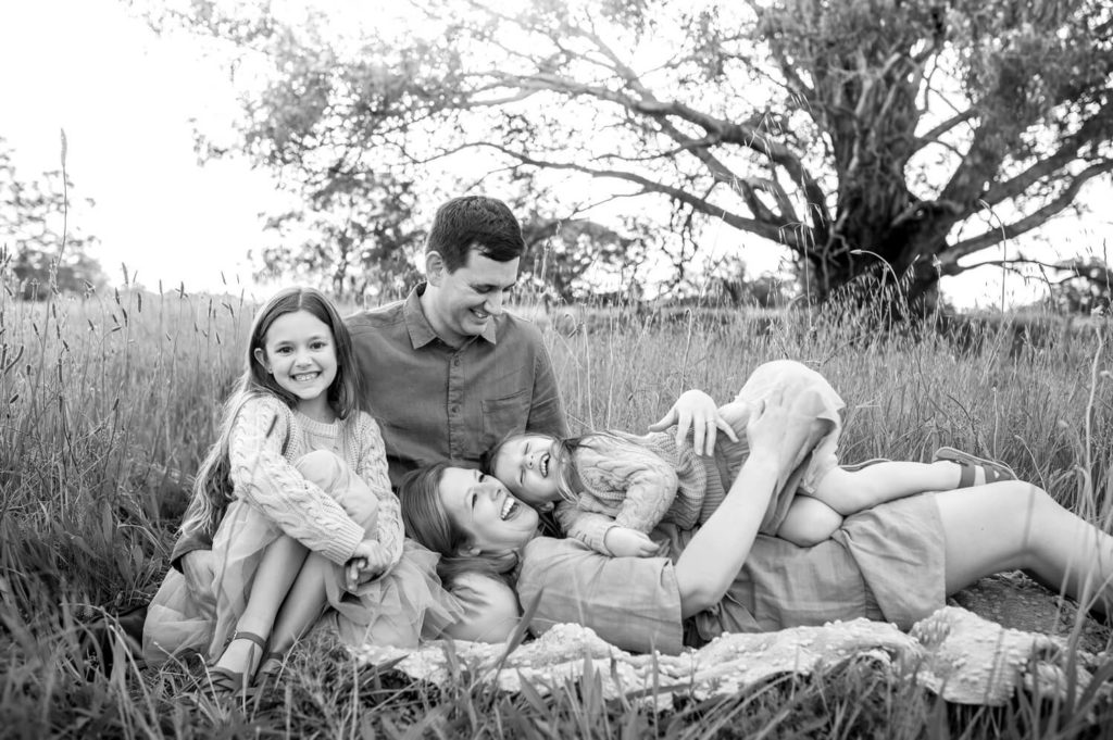 Perth family playing together during outdoor family portrait sessions at Lilac Hill Guildford