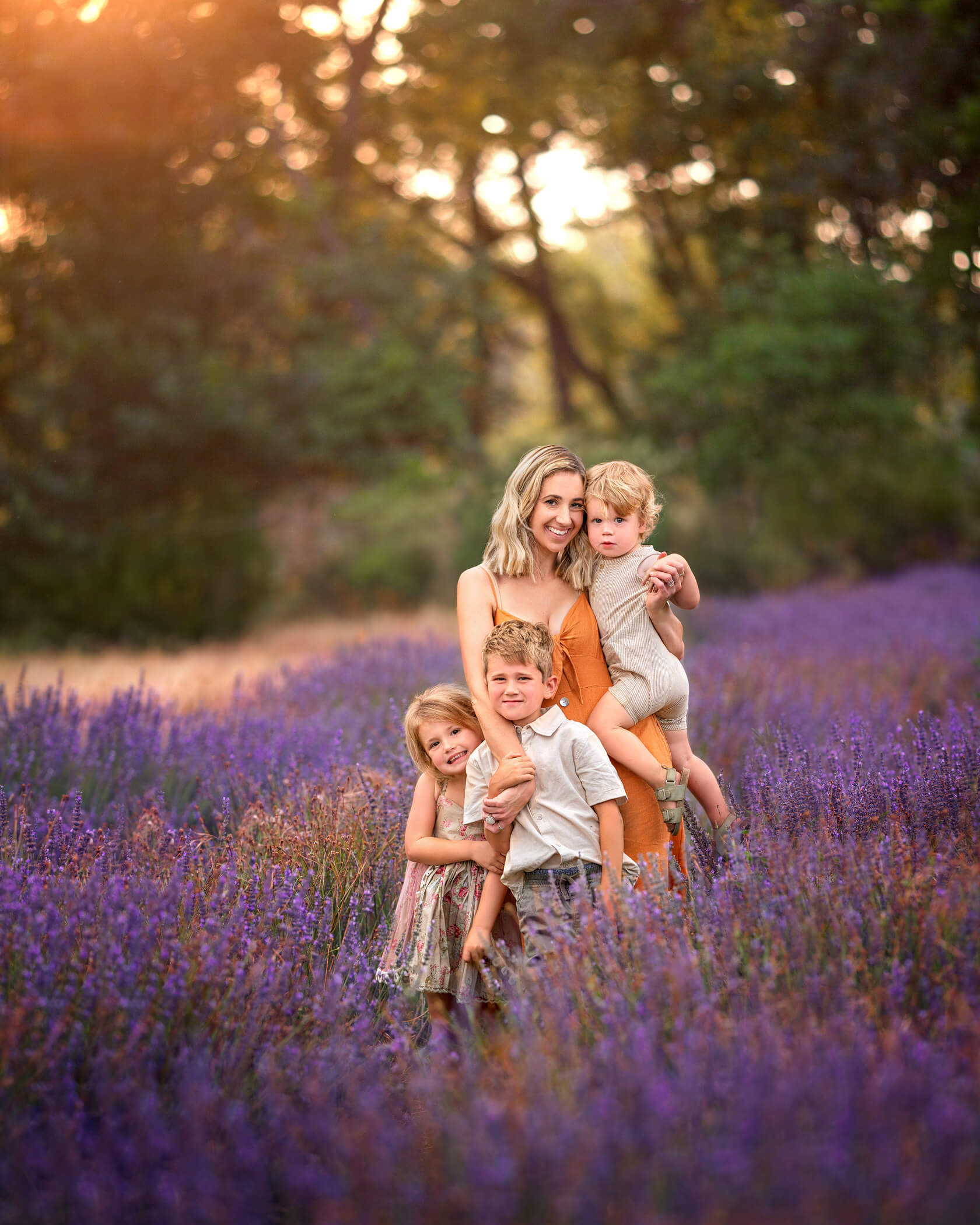 Perth mum posing with 3 kids during sunset photoshoot at a Lavender farm