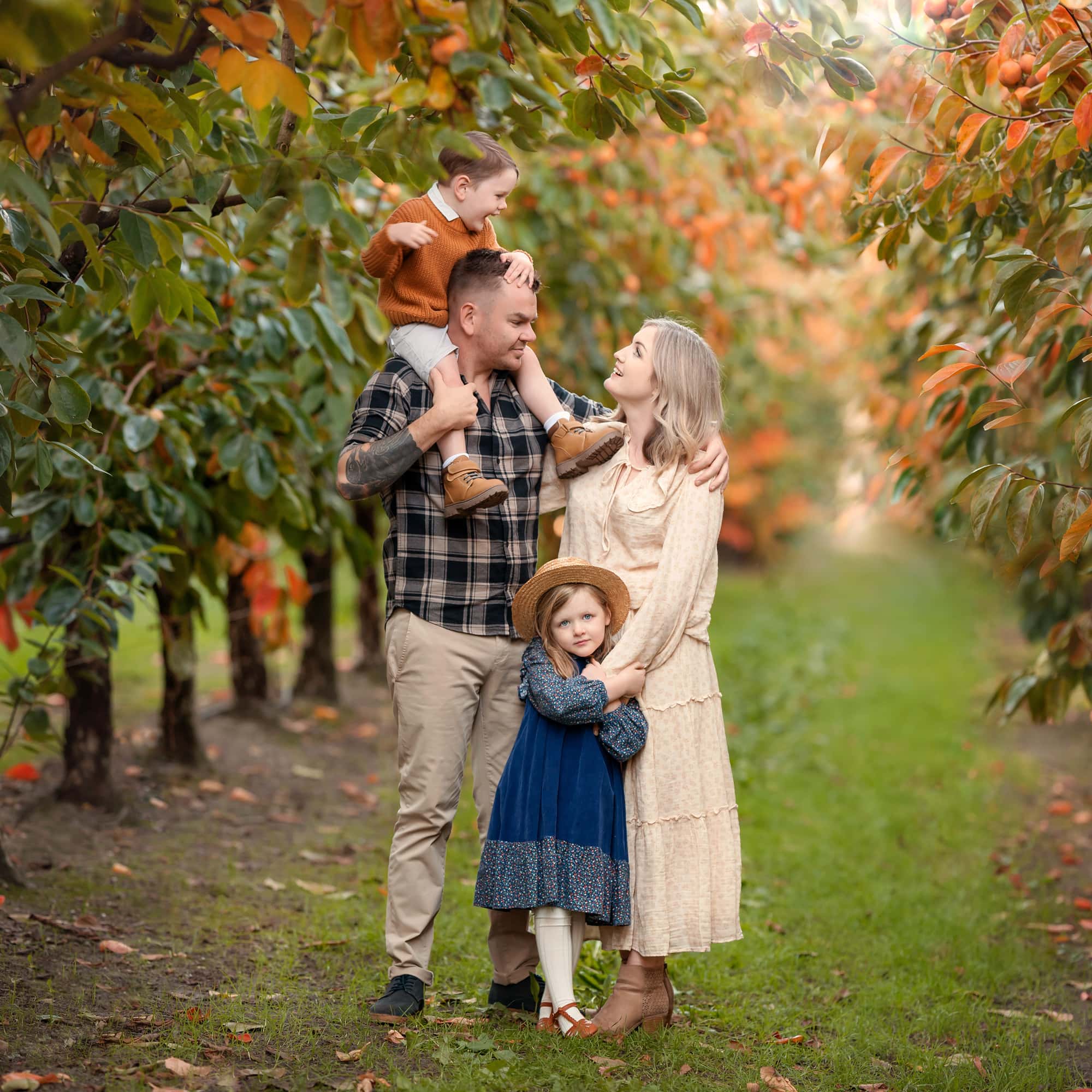 Perth parents with toddlers during an autumn family photoshoot at Raeburn Orchard