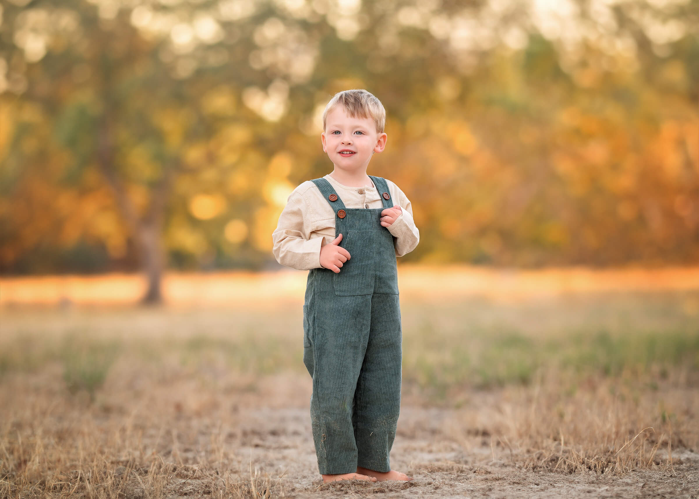 Tips for hiring a family photographer. Perth boy playing during outdoor family photoshoot.
